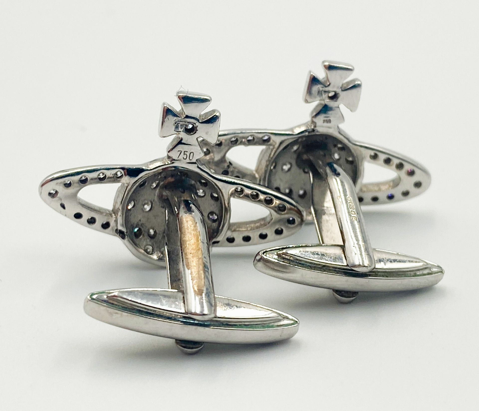 A PAIR OF 18K WHITE GOLD (STAMPED & TESTED) DIAMOND SET VIVIENNE WESTWOOD CUFFLINKS. 2.5cm length, - Image 3 of 12