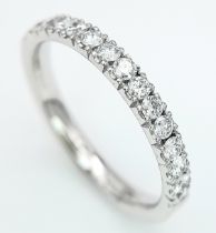 AN 18K WHITE GOLD DIAMOND HALF ETERNITY RING. 0.50ctw, size L, 2.6g total weight. Ref: SC 8075