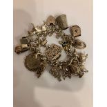 Vintage SILVER CHARM BRACELET Full of interesting and unusual charms. Please see all pictures.