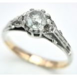 A 9K Yellow Gold (tested) Diamond Solitaire Ring. Size M. 1.9g total weight.