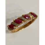 Classic 9 carat GOLD RUBY and DIAMOND RING. having Rubies and Diamonds sweep mounted. Full UK