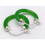 A Pair of Green Jade Hoop Earrings.