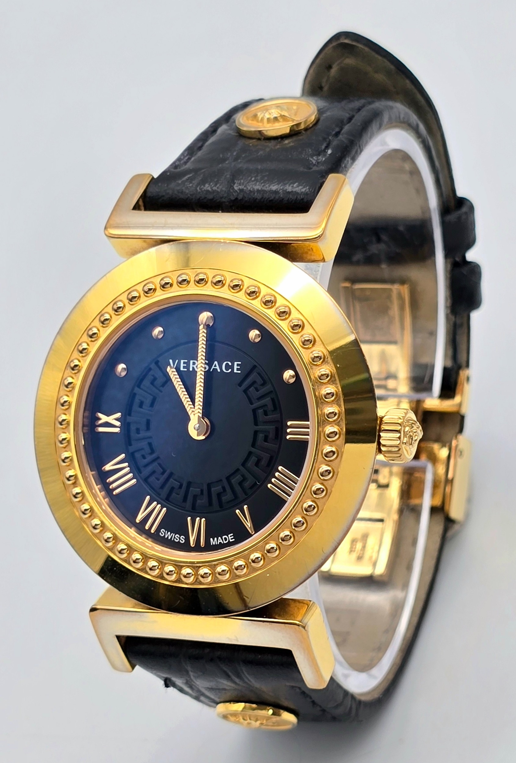 A Versace Designer Quartz Ladies Watch. Black leather and gilded strap and case - 35mm. Black dial