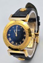 A Versace Designer Quartz Ladies Watch. Black leather and gilded strap and case - 35mm. Black dial