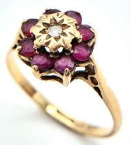 A 9K YELLOW GOLD DIAMOND & RUBY CLUSTER RING. Size M, 1.7g total weight. Ref: SC 8015