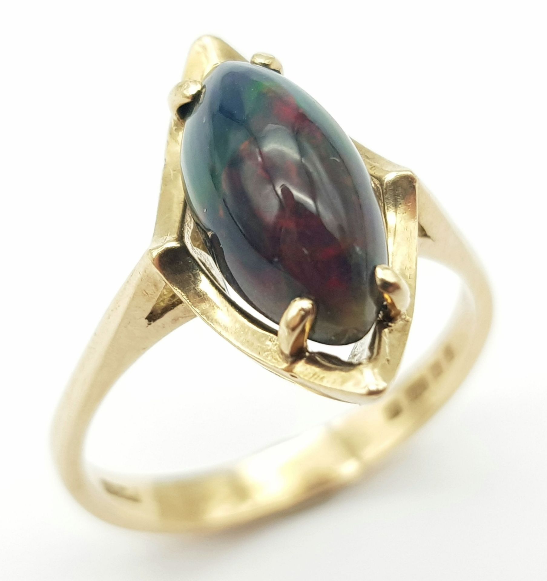 A Vintage 9K Yellow Gold Marquise Cut Opal Ring. Size O. 2.9g total weight.