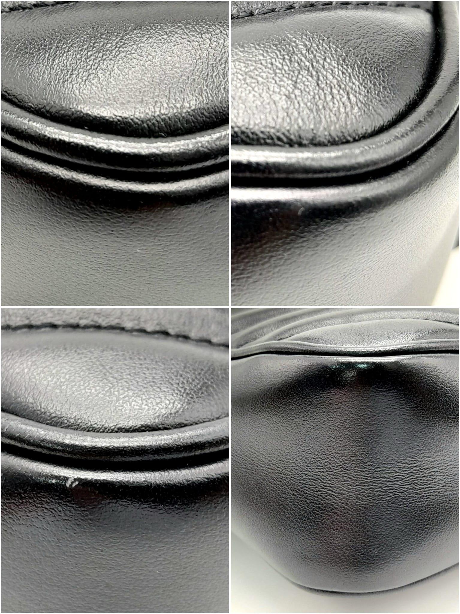 A YSL Saint Laurent Black Lou Matelasse Camera Bag. Leather exterior, gold-tone hardware, adjustable - Image 7 of 11