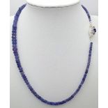 A 75ctw Tanzanite Gemstone Single Strand Necklace with Sapphire and Diamond Clasp. 42cm length.