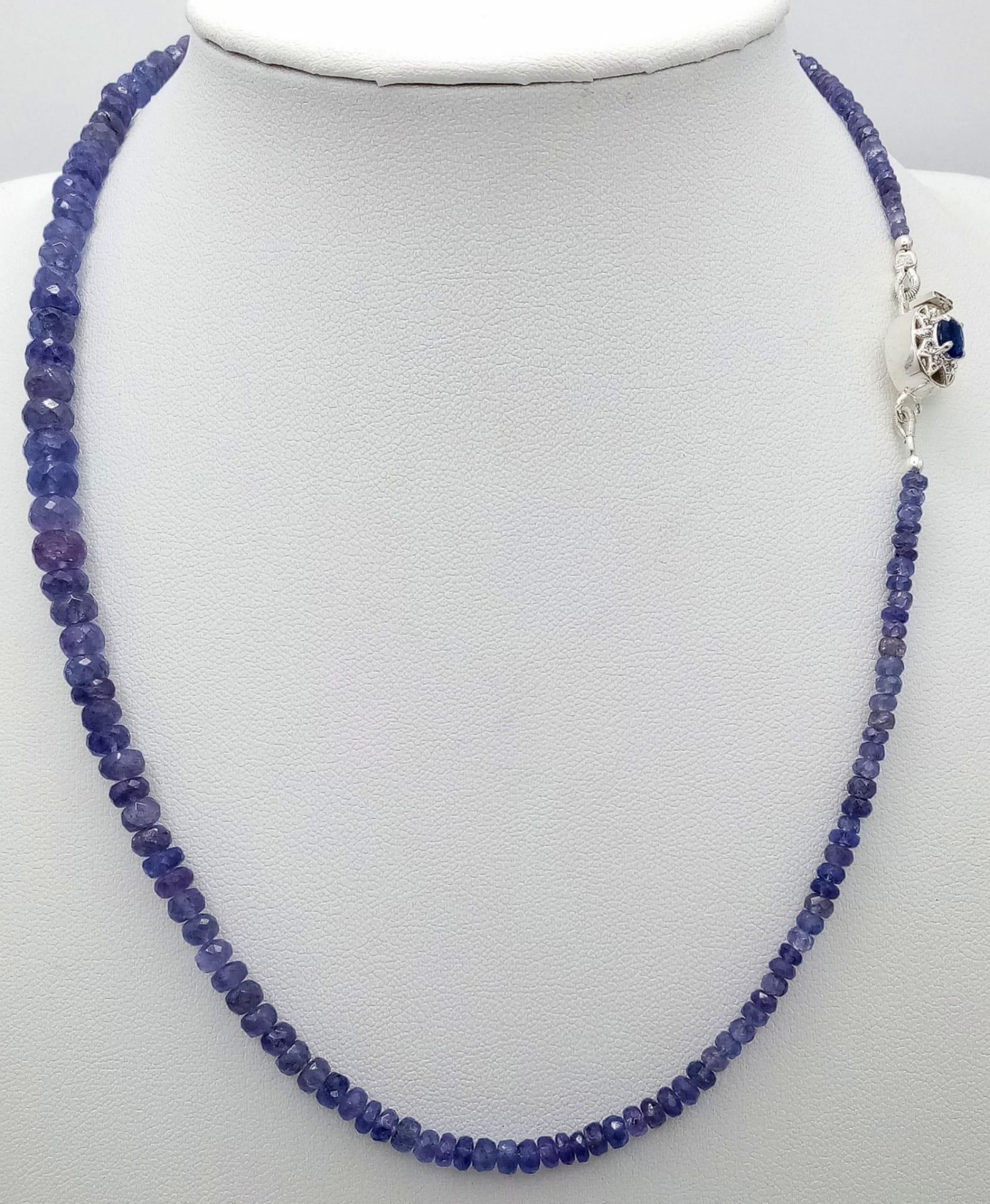 A 75ctw Tanzanite Gemstone Single Strand Necklace with Sapphire and Diamond Clasp. 42cm length.