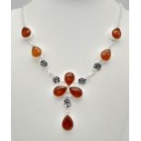 An Amber Resin Necklace set in 925 Silver. 50cm.