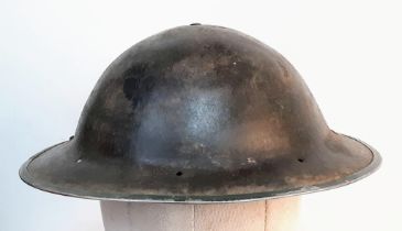 WW2 South African MK II “Tommy” Helmet. The holes at the back are for a cloth nape protector