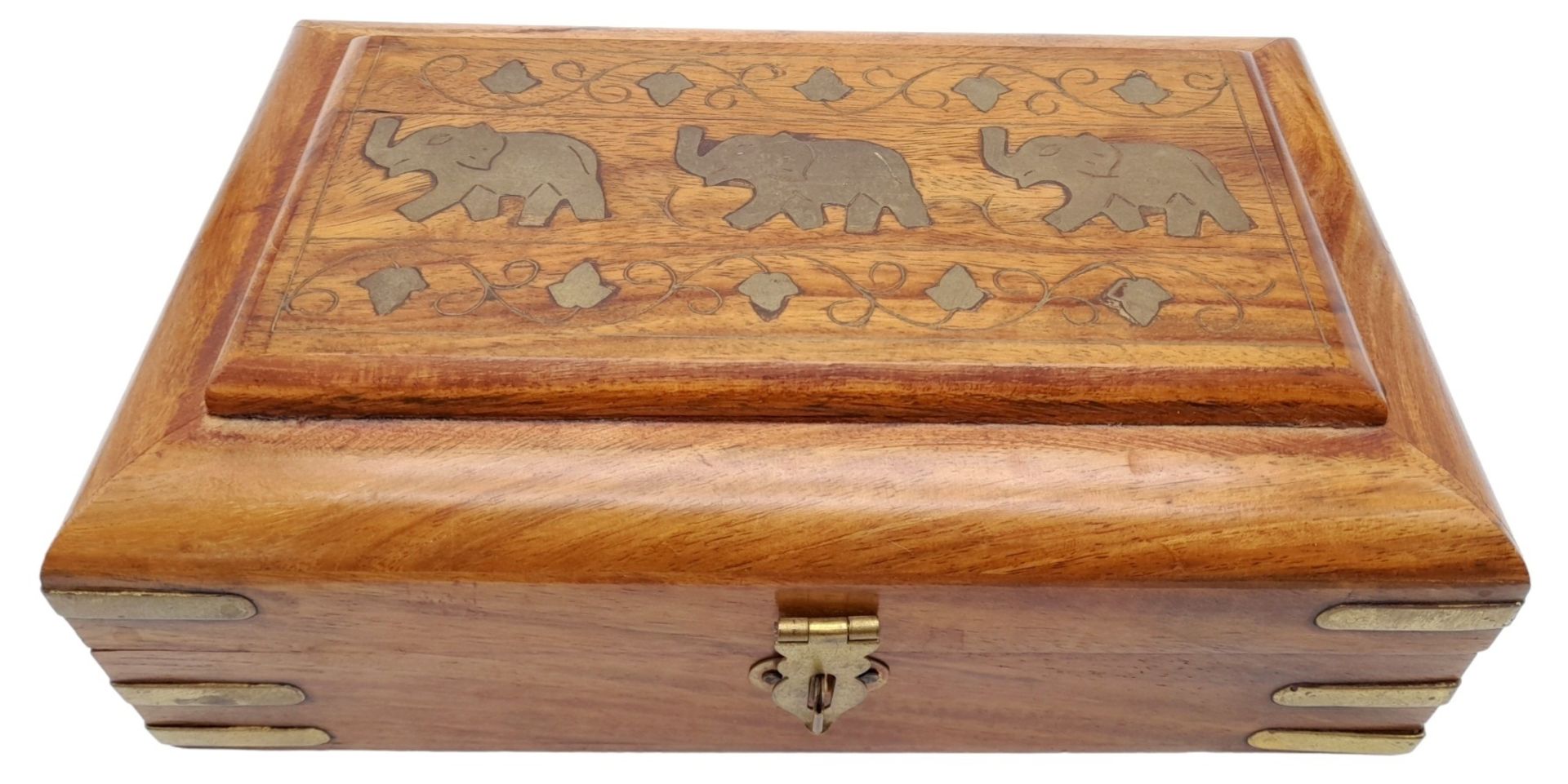 A Wooden Box with an Elephant Motif. Purple textile interior. 20.5cm length x 12.5cm width x 7.5cm