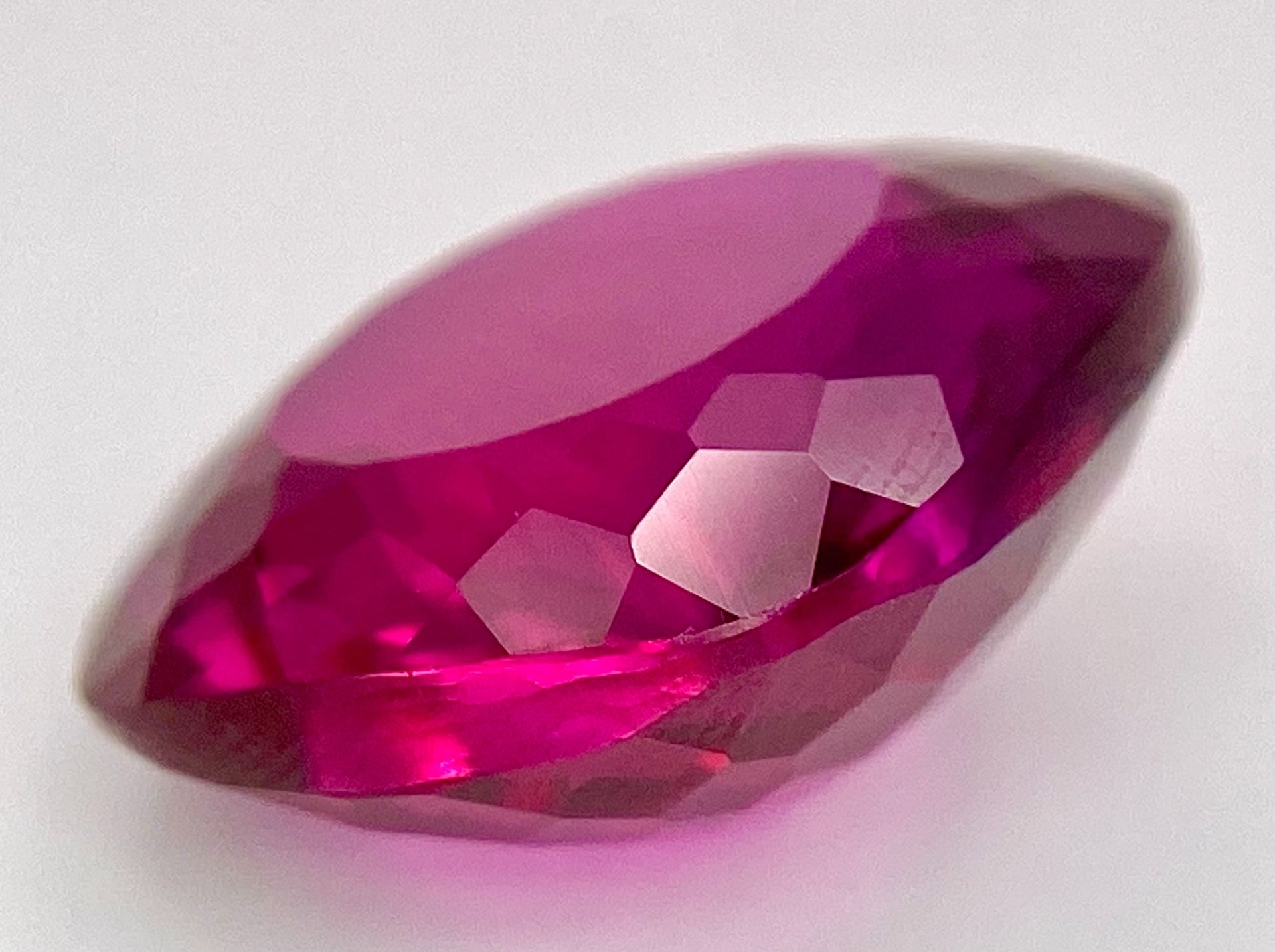 A 27ct Purple Rhodolite Stone. Cushion cut. No certificate so as found. - Image 2 of 3