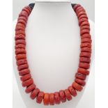 A Red Coral Rondelle Necklace. 44cm.