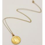A 9 K yellow gold chain necklace with a religious pendant with the Holy Mother on one side the the