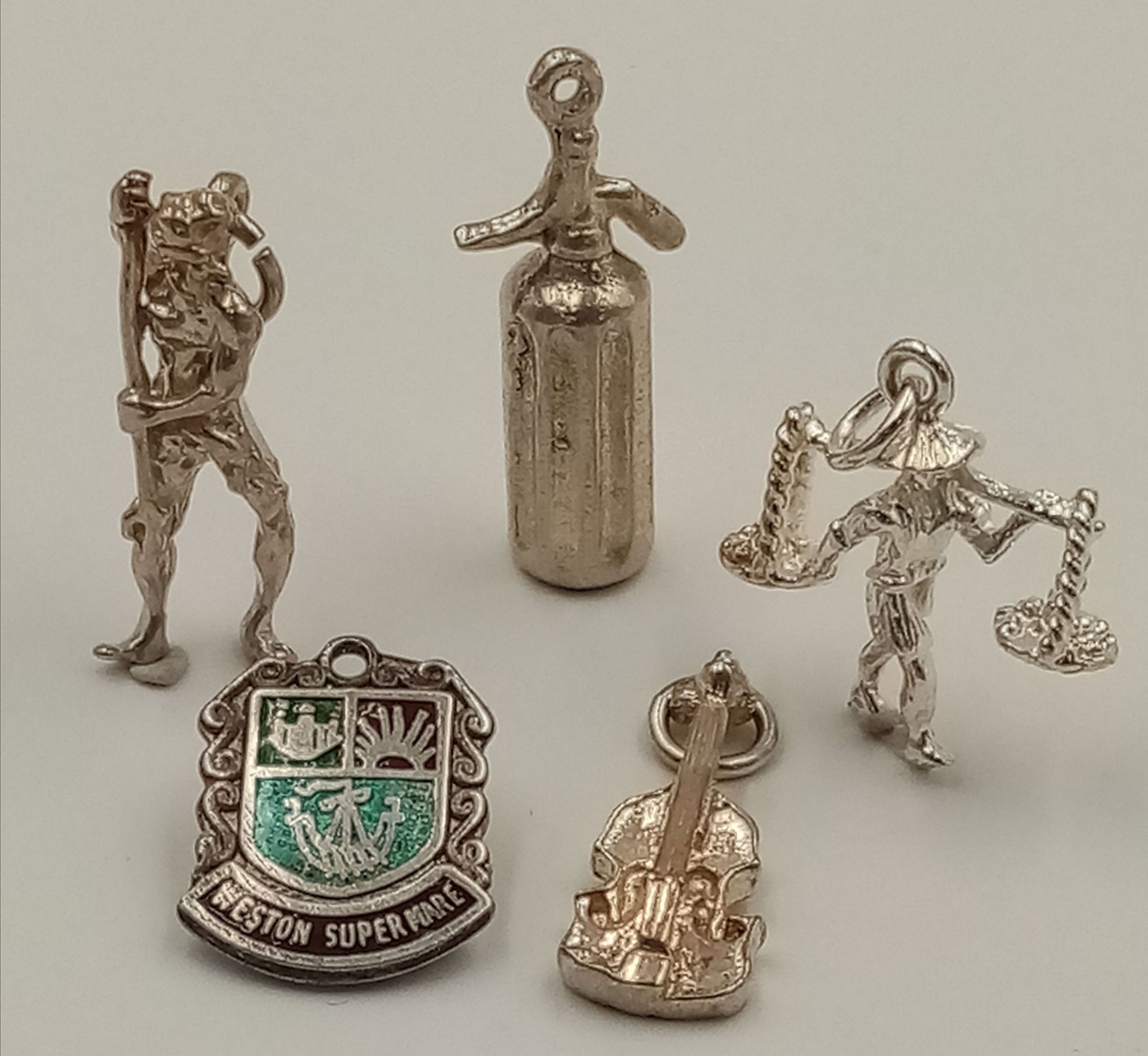 A Selection of 5x sterling silver charms of different designs 10.6g total weight. ref: TB08
