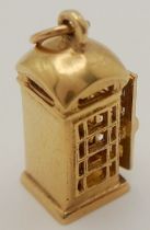A 9K YELLOW GOLD LONDON PHONE BOX CHARM, WHICH OPENS. 2.3cm length, 3.1g weight. Ref: SC 8016