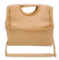 A Chanel Two-Way Chain Shoulder Bag. Beige caviar leather. Gold tone hardware. Spacious interior