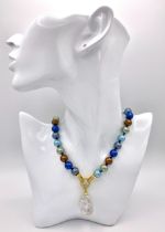 A Beautiful Metallic Multi Coloured Pearl Shell Necklace with a Hanging Keisha Baroque Pearl