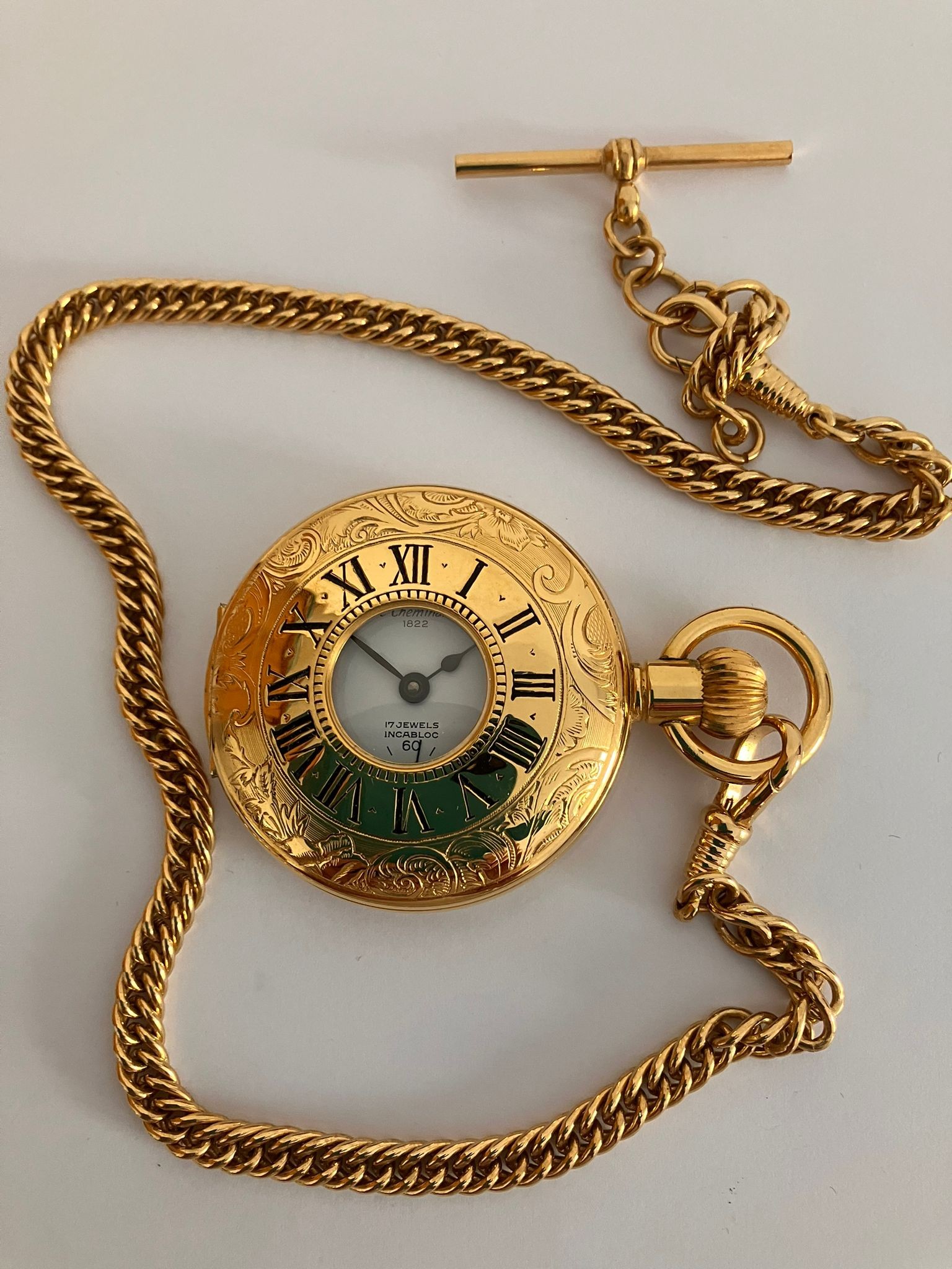 Le CHEMINANT Gilded HALF HUNTER POCKET WATCH.Having gilded chain with clasp and T-bar. Manual