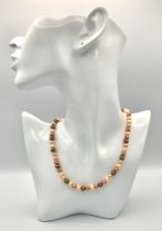 A multi coloured cultured pearl necklace with a silver clasp. length; 42 cm, weight: 21.2 g.