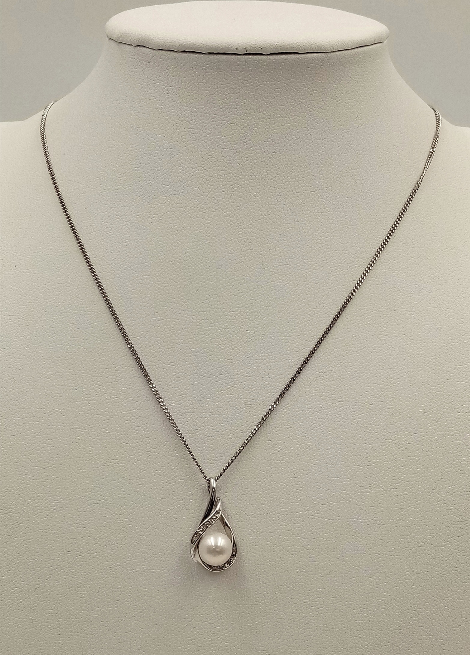 A 9ct White Gold Diamond and Pearl Necklace, 6mm pearl size, 0.05ct diamond, 20” chain length, 4. - Image 3 of 4
