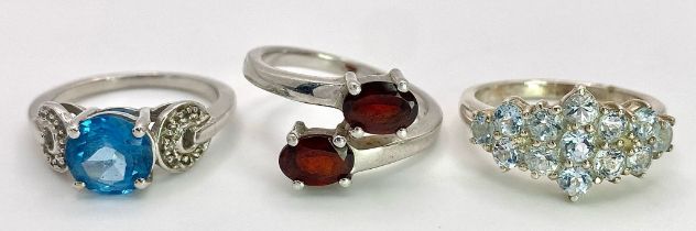 Three 925 Sterling Silver Gemstone Rings: Topaz - Size N, Garnet - Size P and Aquamarine- Size N.