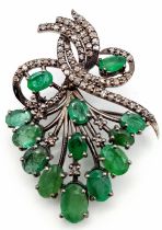 An Emerald and Diamond Decorative Floral Brooch with Emeralds - 7ctw and Diamonds 1.1ctw. 4cm. 5.