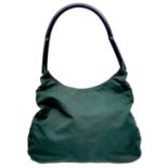 A Prada Green Tessuto Handbag. Textile exterior with plastic handle and velcro top closure. Black