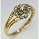 An 18K Yellow Gold Diamond Cluster Ring. 0.25ctw diamonds. Size N. 2.6g total weight.