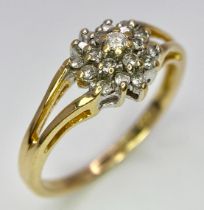An 18K Yellow Gold Diamond Cluster Ring. 0.25ctw diamonds. Size N. 2.6g total weight.