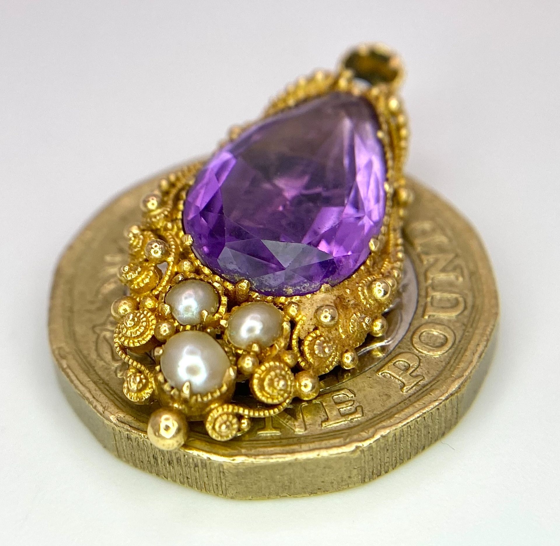 An Antique 18K Gold (tests as) Amethyst and Seed Pearl Pendant. 2.5cm. 3.3g total weight. - Image 3 of 4