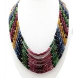 A fabulous 420ctw Ruby, Emerald and Sapphire multi-strain necklace with Asian embroidered
