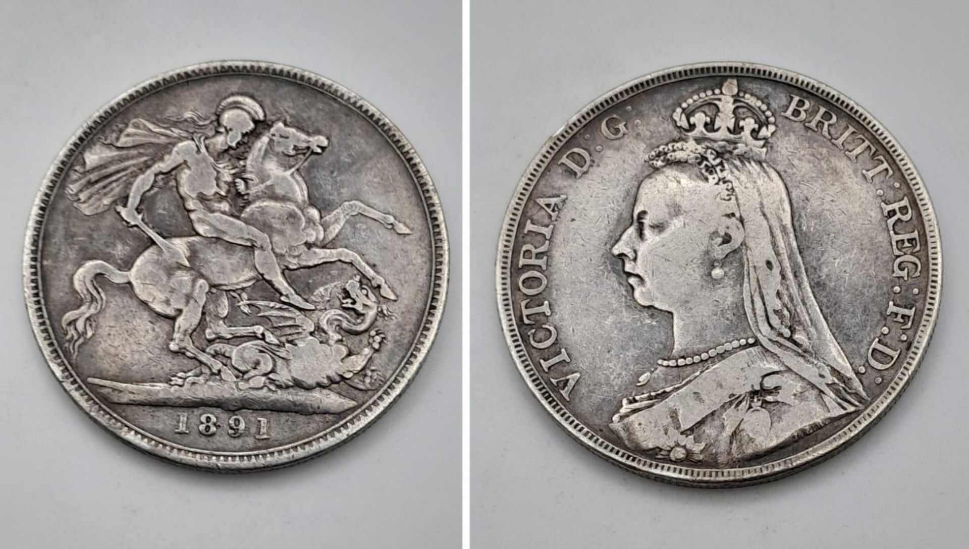 An 1891 Queen Victoria Silver Crown Coin. VF grade but please see photos.