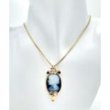 A Beautiful 9K Gold, Cameo Pendant with Sapphire and Diamond decoration on a 9K link chain.