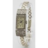 An Antique Art Deco Platinum and Diamond Ladies Watch. Note: Original bracelet has been replace with