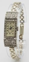 An Antique Art Deco Platinum and Diamond Ladies Watch. Note: Original bracelet has been replace with
