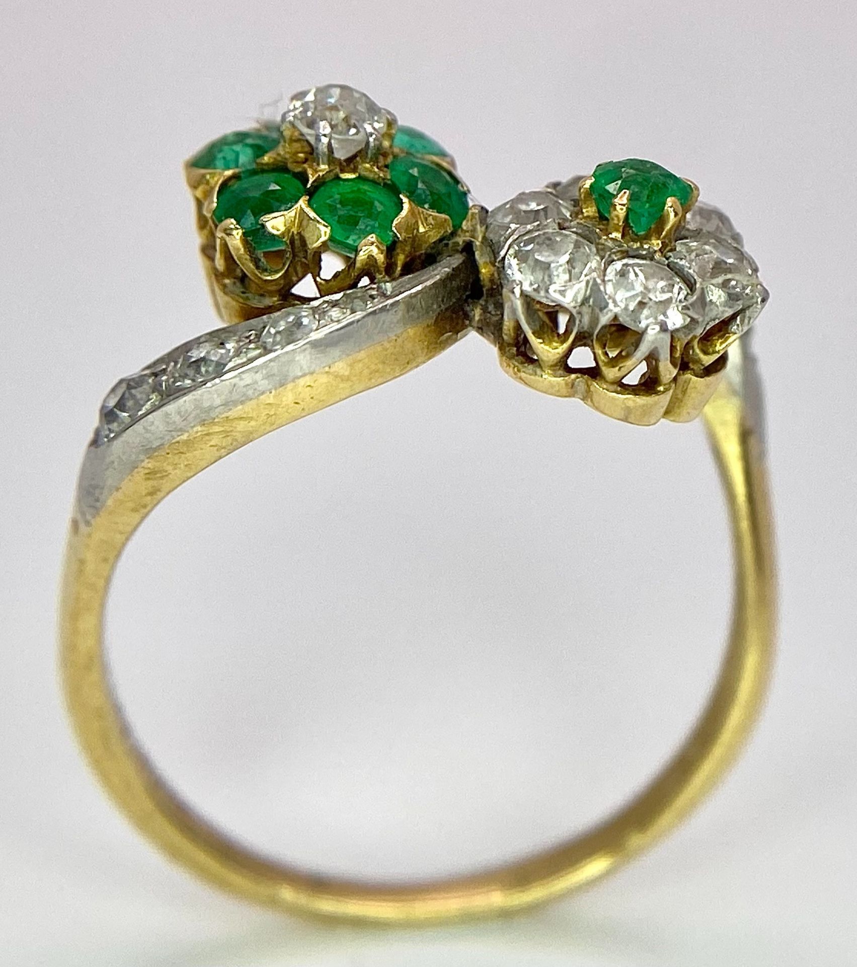 A Vintage 18K Yellow Gold, Platinum, Emerald and Diamond Crossover Ring. Reverse flowers with - Image 6 of 9