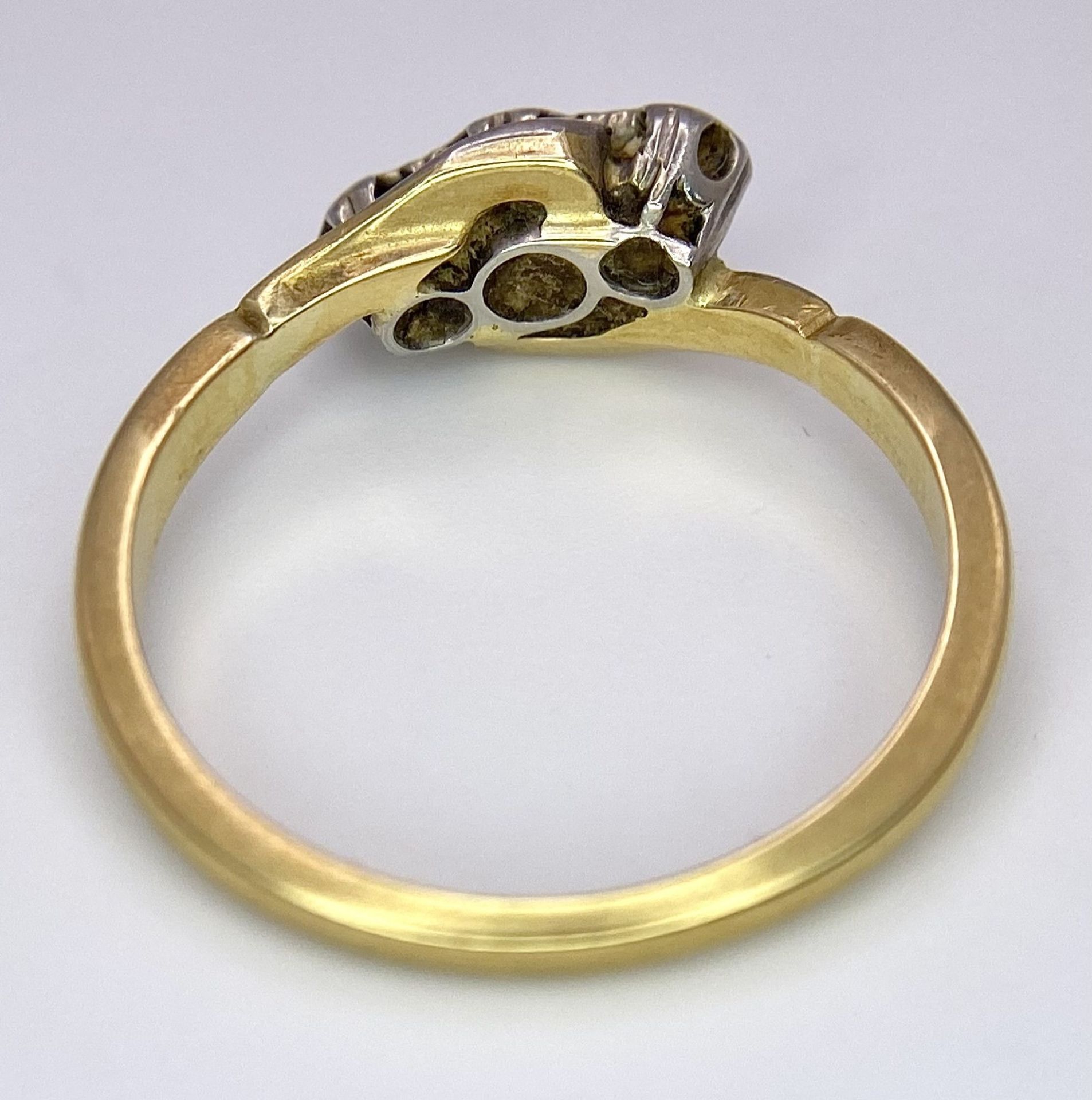 A Vintage 18K Yellow Gold, Platinum and Old Cut Diamond Crossover Ring. Three old cut gypsy-set - Image 5 of 6