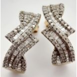 A Pair of 9K Yellow Gold and Diamond Earrings. Round and baguette cut diamonds. 2.5cm drop. 5.1g
