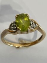 Dainty 9 carat GOLD and PERIDOT RING . Having nicely cut oval PERIDOT to top. 1.6 grams. Size J -