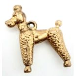 A 9 K yellow gold charm in the shape of a poodle dog. Dimensions: 24 x 18 x 5 mm, weight: 1 g.