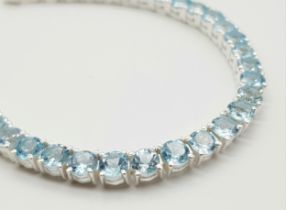 A Blue Topaz Gemstone Tennis Bracelet set in 925 Silver. 18cm. Ref: CD-1279