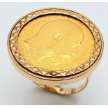 A 9 K yellow gold ring with a full 1902 sovereign which is not welded to the ring and can easily