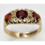 A 9K Yellow Gold, Garnet and Diamond Ring. Size K, 1.9g total weight. Comes in presentation case.