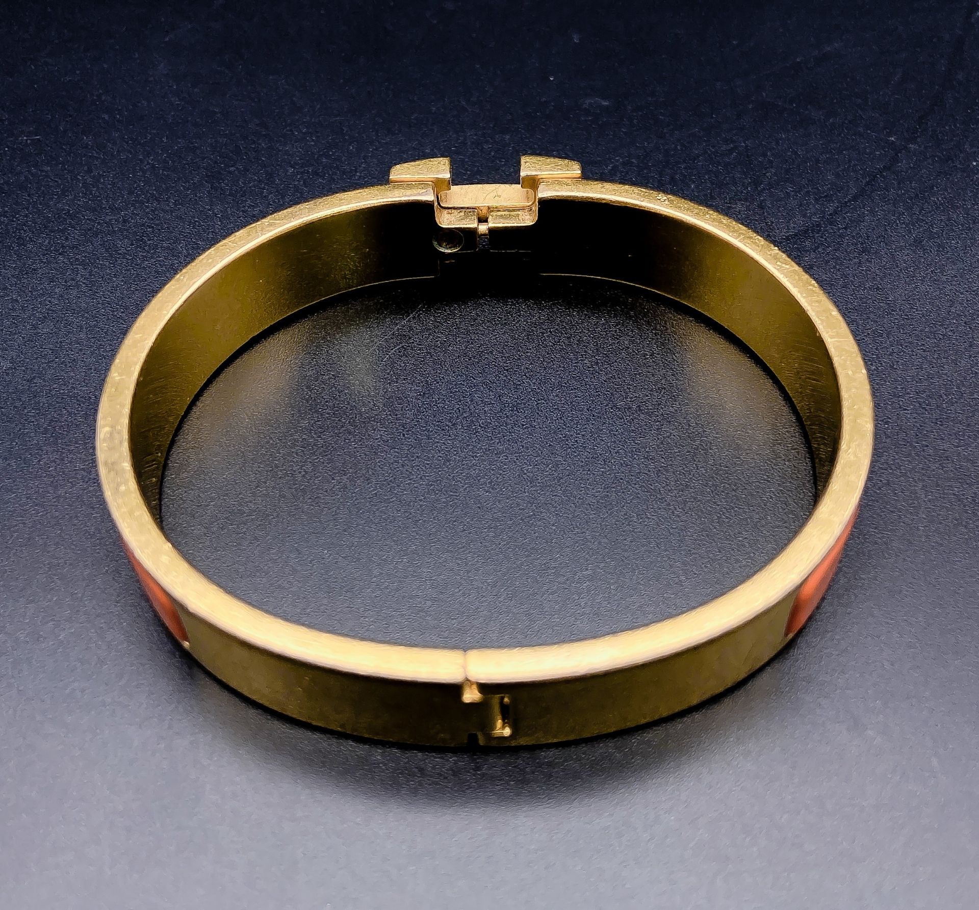 A Hermes Gold Plated and Inlaid Orange Enamel Bangle. 6cm inner diameter. Comes with original Hermes - Image 3 of 5