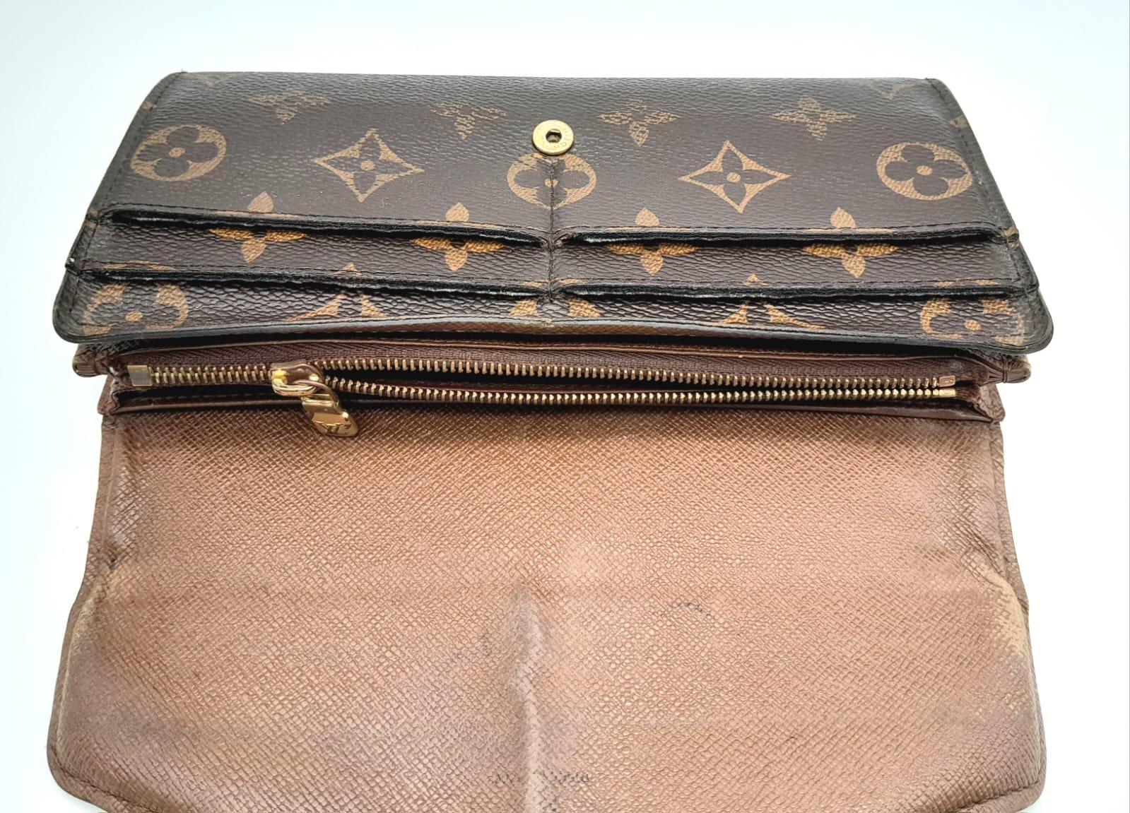 A Louis Vuitton Monogram Wallet. Leather exterior with an open compartment on back and press stud - Image 7 of 10