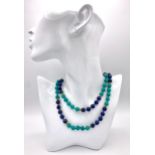 A Lapis Lazuli and Turquoise Matinee Length Beaded Necklace. 94cm length. Gilded spacers and