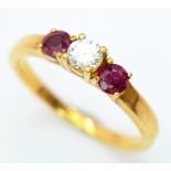 AN 18K YELLOW GOLD DIAMOND & RUBY 3 STONE RING. 0.18ctw, Size N, 2.9g total weight. Ref: SC 8064