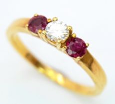 AN 18K YELLOW GOLD DIAMOND & RUBY 3 STONE RING. 0.18ctw, Size N, 2.9g total weight. Ref: SC 8064